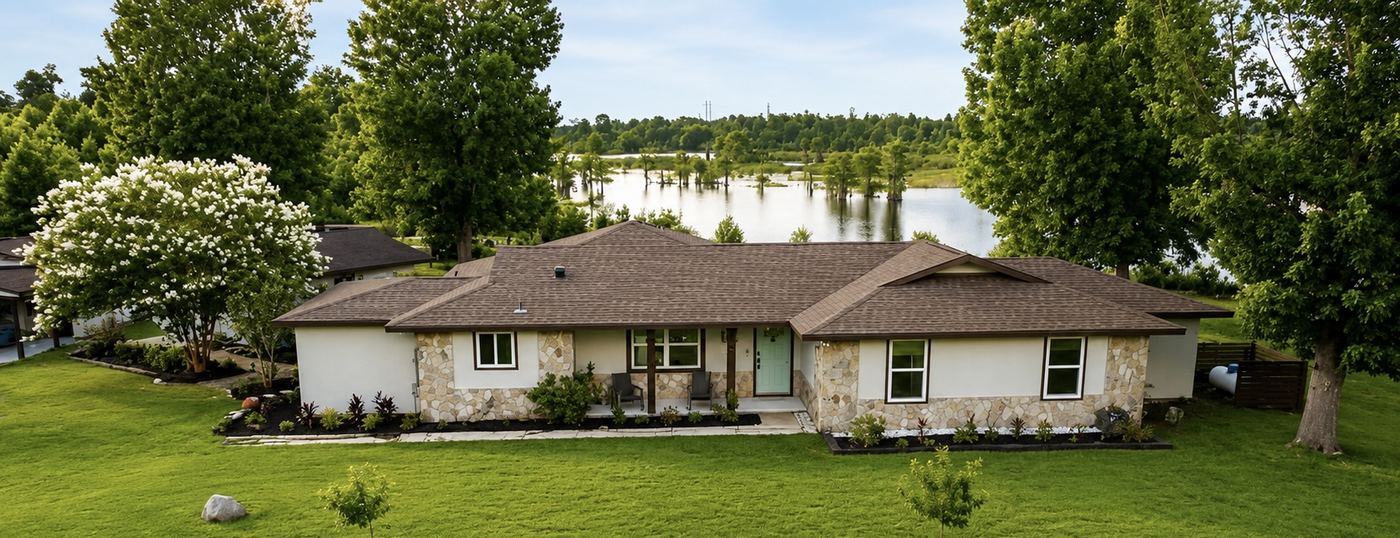 Aerial view of Casa Flora with Deer Point Lake beyond