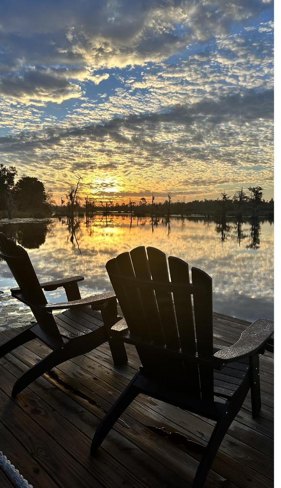 Dawn breaking over the dock chairs